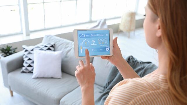 woman-using-application-of-smart-home-automation